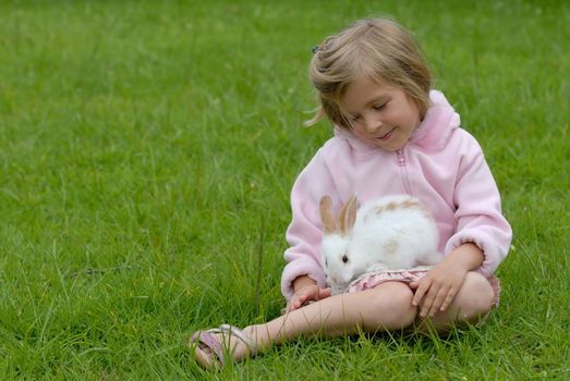 Small girl and the white rabbit.