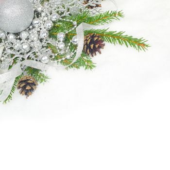 Beautiful Christmas decor and fir branches on snow woth white copy space