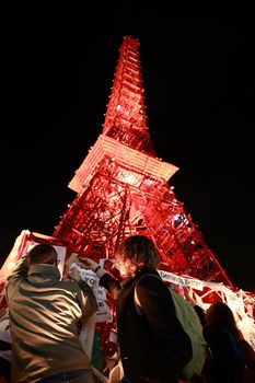FRANCE, Paris: Activists place messages on a replica of the Eiffel Tower nearby the 2015 United Nations Climate Change Conference in Le Bourget, a Paris suburb, on December 9, 2015 to put pressure on world leaders. Worldwide protests have called on leaders to come to an agreement for preserving the environment by the summit's end on December 11.