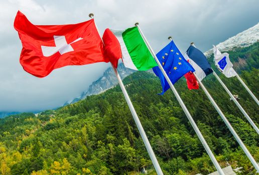 European Union National Flags. Switzerland, Italy, European Union Flag and France. Mont Blanc Tunnel. Chamonix, France, Europe.