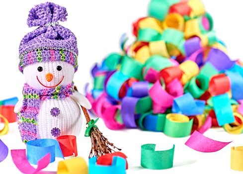 New Year 2016. Happy Snowman. Party decoration multicolored serpentine confetti. Cheerful fun winter holiday on white background, copyspace.Snowman celebration in festive hat, scarf smiling with broom