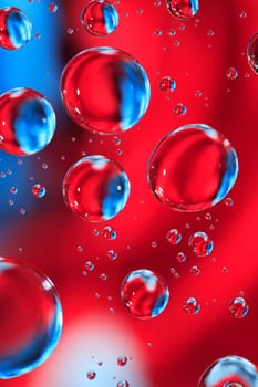 Abstract red and blue background with various water drops