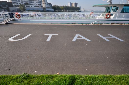 metal lettering UTAH on the pavement on the promenade in front of hotel New York in Rotterdam Holland