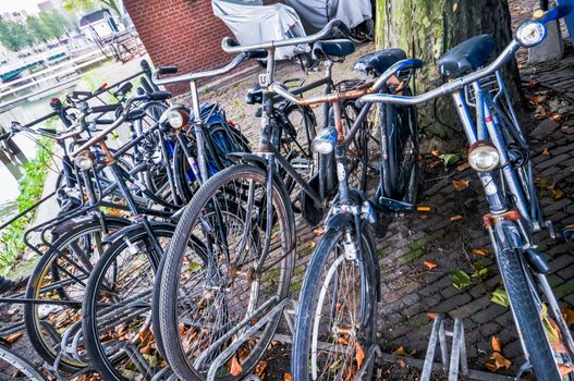 old shabby rusty bikes on the streets of Rotterdam Holland