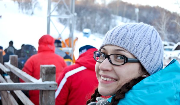 portrait of a young pretty girl with glasses and winter clothes