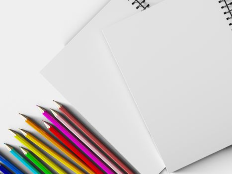 notebook with colored pencils on White background, stationary object