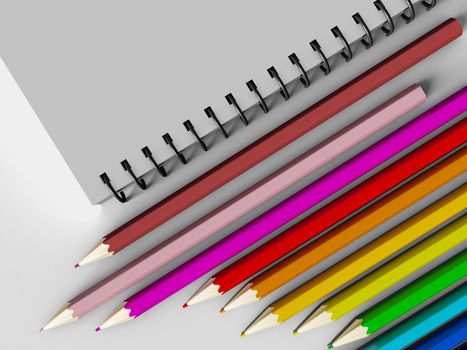 notebook with colored pencils on White background, stationary object