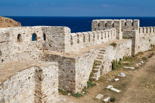 Medieval castle in Tenedos, Bozcaada, Turkey at seacoastline.
