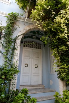 BOZCAADA, TURKEY - SEPTEMBER 14, 2015: View of street in Tenedos, Canakkale, front of houses. Bozcaada is a very famous summer travel destination in Turkey.