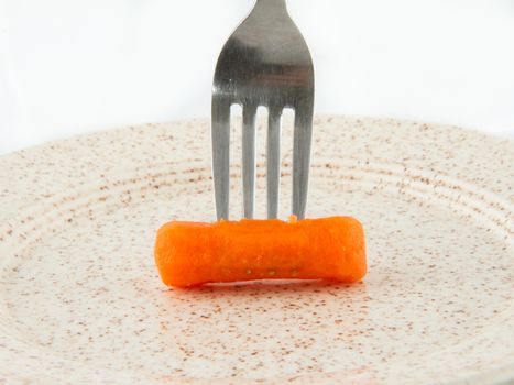 Dieter is eating his one carrot for the night