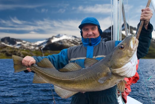 Fisherman on the boat near Lofoten island