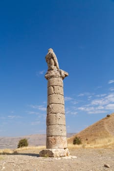 View of Karakus Tumulus, ancient historical and blessed area of Nemrut National Park, on clear blue sky background.