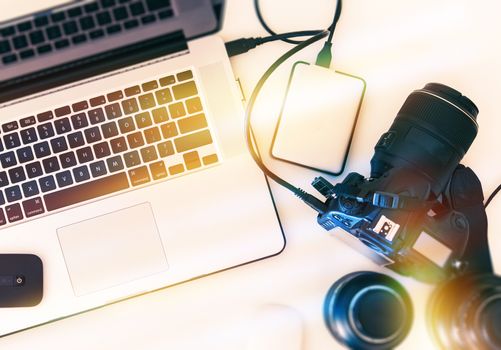 Digital Photography Workstation From Above. Modern Digital Camera, Lenses and Laptop Computer.