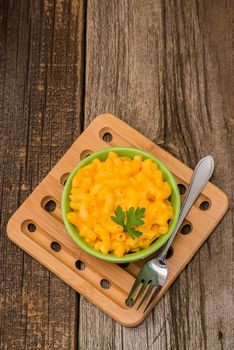 Overhead view of a bowl of macaroni and cheese.