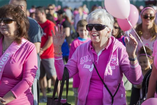 TUCSON, PIMA COUNTY, ARIZONA, USA - OCTOBER 18:  Unidentified mature woman cheering before the 2015 American Cancer Society Making Strides Against Breast Cancer walk, on October 18, 2015 in Tucson, Arizona, USA.