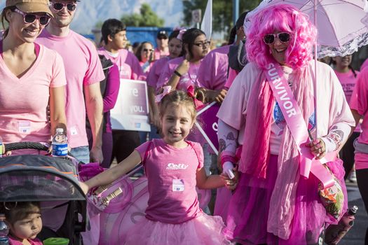 TUCSON, PIMA COUNTY, ARIZONA, USA - OCTOBER 18:  Unidentified breast cancer survivor with young girl and other walkers in the 2015 American Cancer Society Making Strides Against Breast Cancer walk, on October 18, 2015 in Tucson, Arizona, USA.