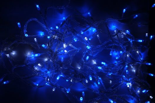 Blue lighting background, blue decorative garland