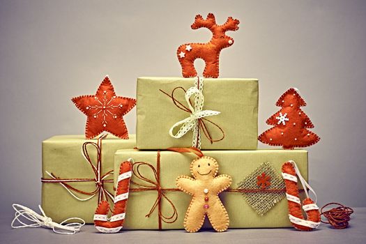 Gift boxes, gingerbread men. Christmas, candy cane deer fir tree and star. Kraft paper bows ribbons lace. Festive creative New Year. Retro, vintage, greeting card, party decoration handmade, closeup