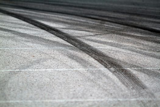 Background with tire marks on road track