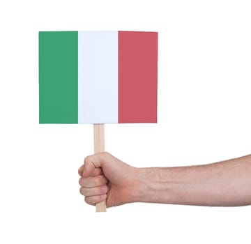 Hand holding small card, isolated on white - Flag of Italy