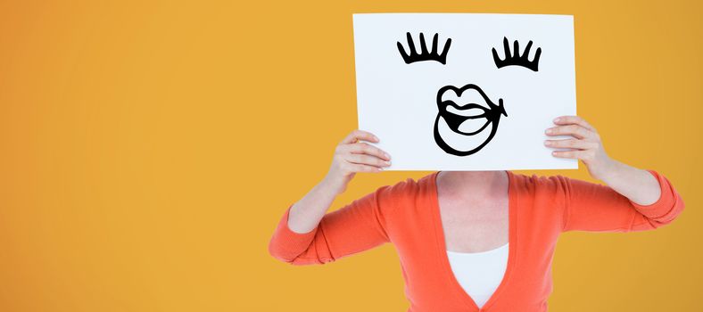 Woman holdinh blank billboard in front of face against yellow