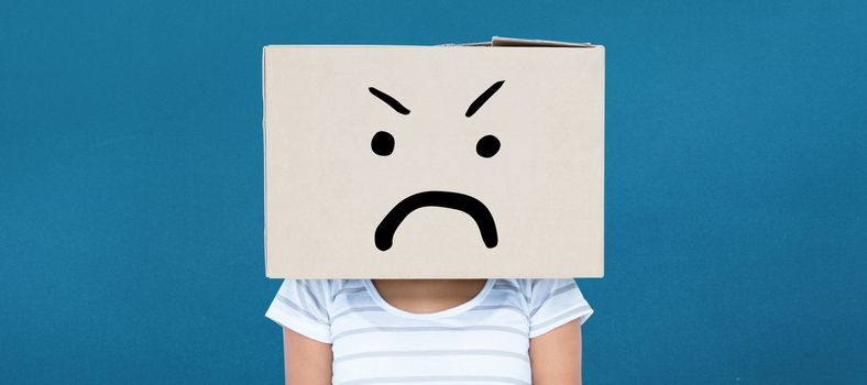 Depressed woman with box over head against blue background