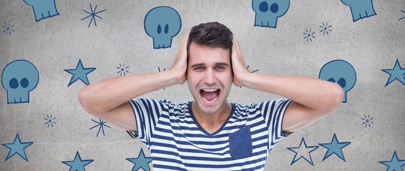 Handsome man screaming while covering ears against grey room
