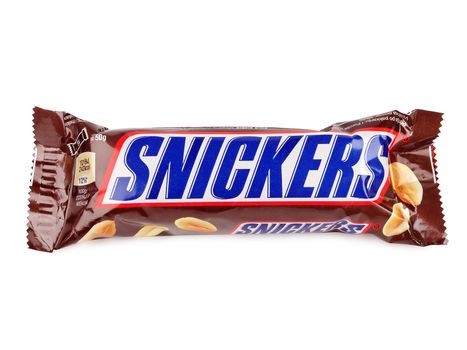 PULA, CROATIA - DECEMBER 6, 2015: Snickers chocolate bar isolated on white background. Snickers bars are produced by Mars Incorporated. Snickers was created by Franklin Clarence Mars in 1930