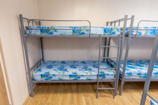 bunk metal beds in clean hostel room