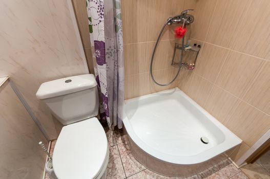 combined bathroom with sink toilet and shower tray