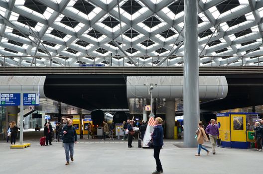 The Hague, Netherlands - May 8, 2015: Travelers at central Station of The Hague, Netherlands on May 8, 2015. The station is the largest railway station in The Hague.