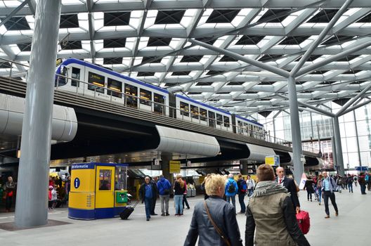 The Hague, Netherlands - May 8, 2015: Travelers at central Station of The Hague, Netherlands on May 8, 2015. The station is the largest railway station in The Hague.