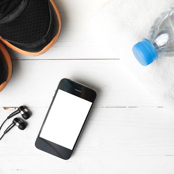 fitness equipment:running shoes,water bottle,towel,smart phone