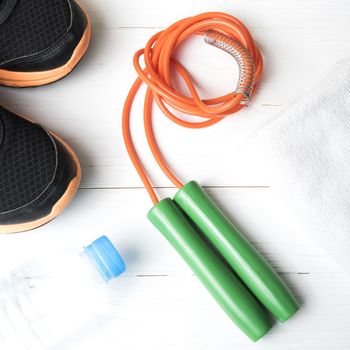 fitness equipment:running shoes,water bottle,towel,rope