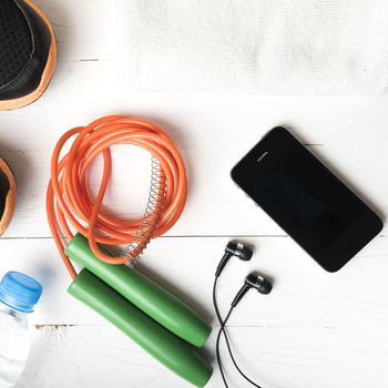 fitness equipment:running shoes,water bottle,towel,rope