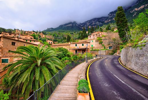 Winding asphalt road in rural area of Tramontana mountains, Mallorca, Spain