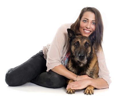 woman and malinois in front of white background