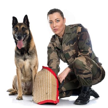 woman soldier and malinois in front of white background