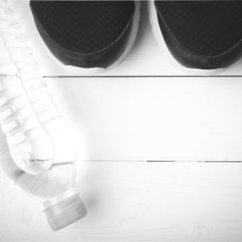 running shoes and drinking water on white table black and white tone color style