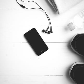 fitness equipment:running shoes,water bottle,towel,smart phone black and white color style