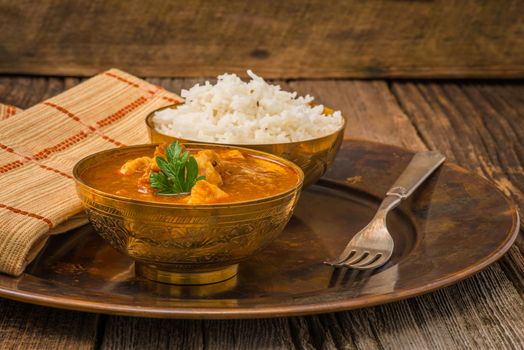 Indian chicken madras served with white basmati rice.