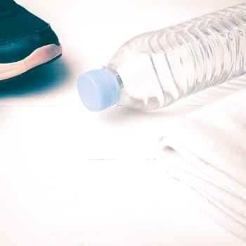 fitness equipment:running shoes,water bottle,towel vintage style