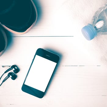 fitness equipment:running shoes,water bottle,towel,smart phone vintage style