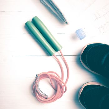 fitness equipment:running shoes,water bottle,towel,rope vintage style