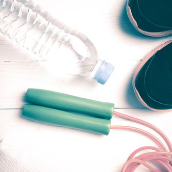 fitness equipment:running shoes,water bottle,towel,rope vintage style