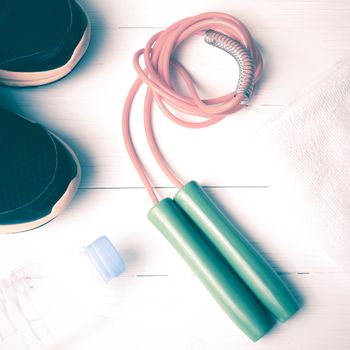 fitness equipment:running shoes,water bottle,towel,rope vintage style