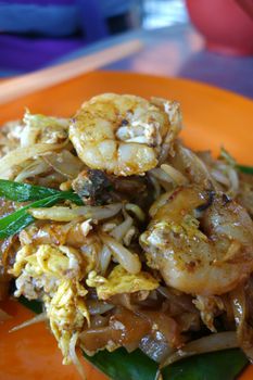 Fried Penang Char Kuey Teow which is a popular noodle dish in Malaysia, Indonesia, Brunei and Singapore