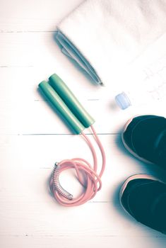 fitness equipment:running shoes,water bottle,towel,rope vintage style