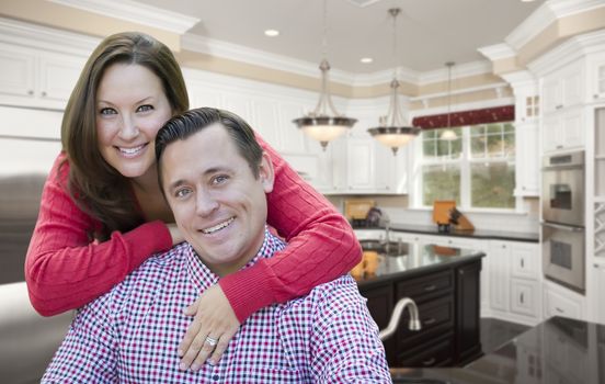 Happy Affectionate Couple In Beautiful New Kitchen.