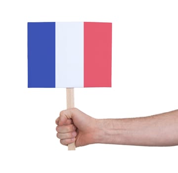 Hand holding small card, isolated on white - Flag of France
